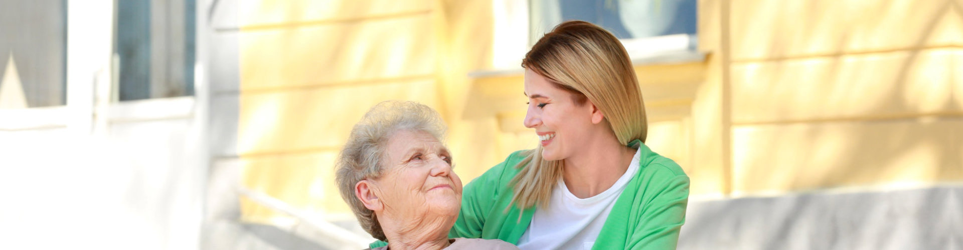 mother and daughter bonds outside their house